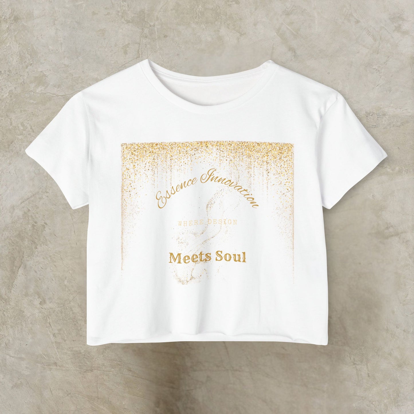 White t-shirt with gold Essence Innovation 'Design Meets Soul' text on a beige background