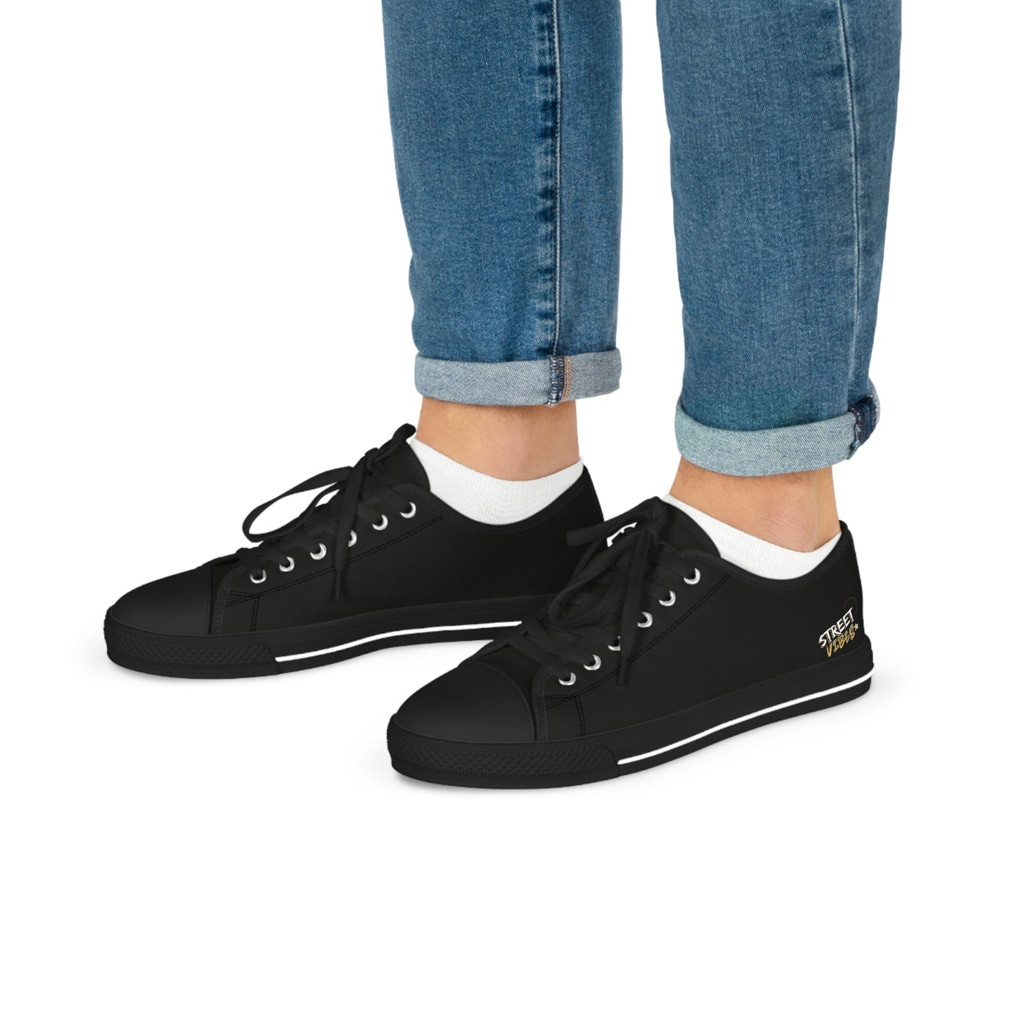 Black Essence Innovation 'Street Vibes' sneakers worn with blue jeans and white socks on a white background