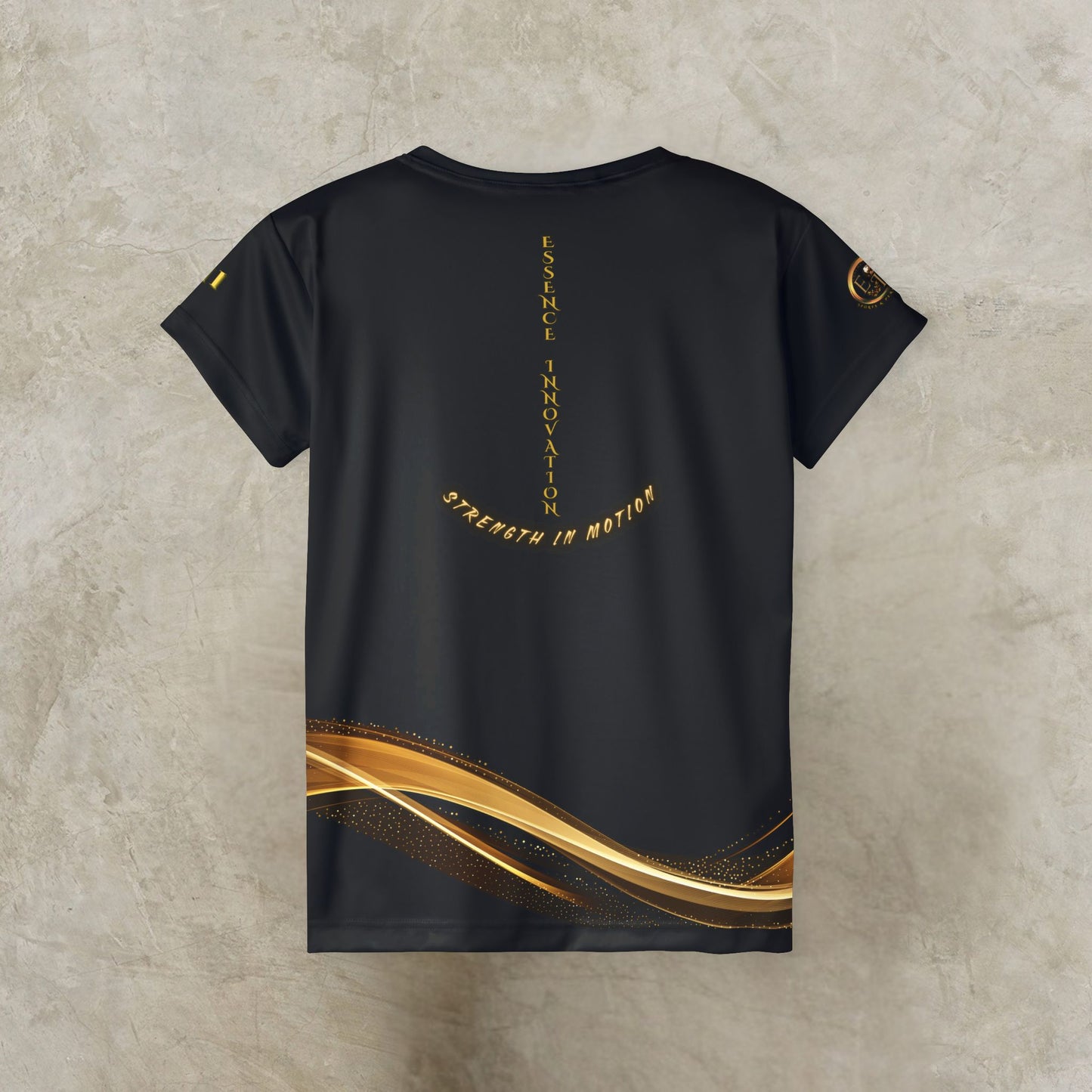 Black t-shirt with gold designs and text on a textured beige background