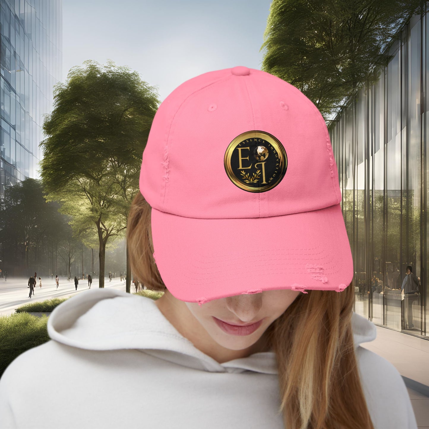Person wearing a pink Essence Innovation cap with a logo in an urban setting