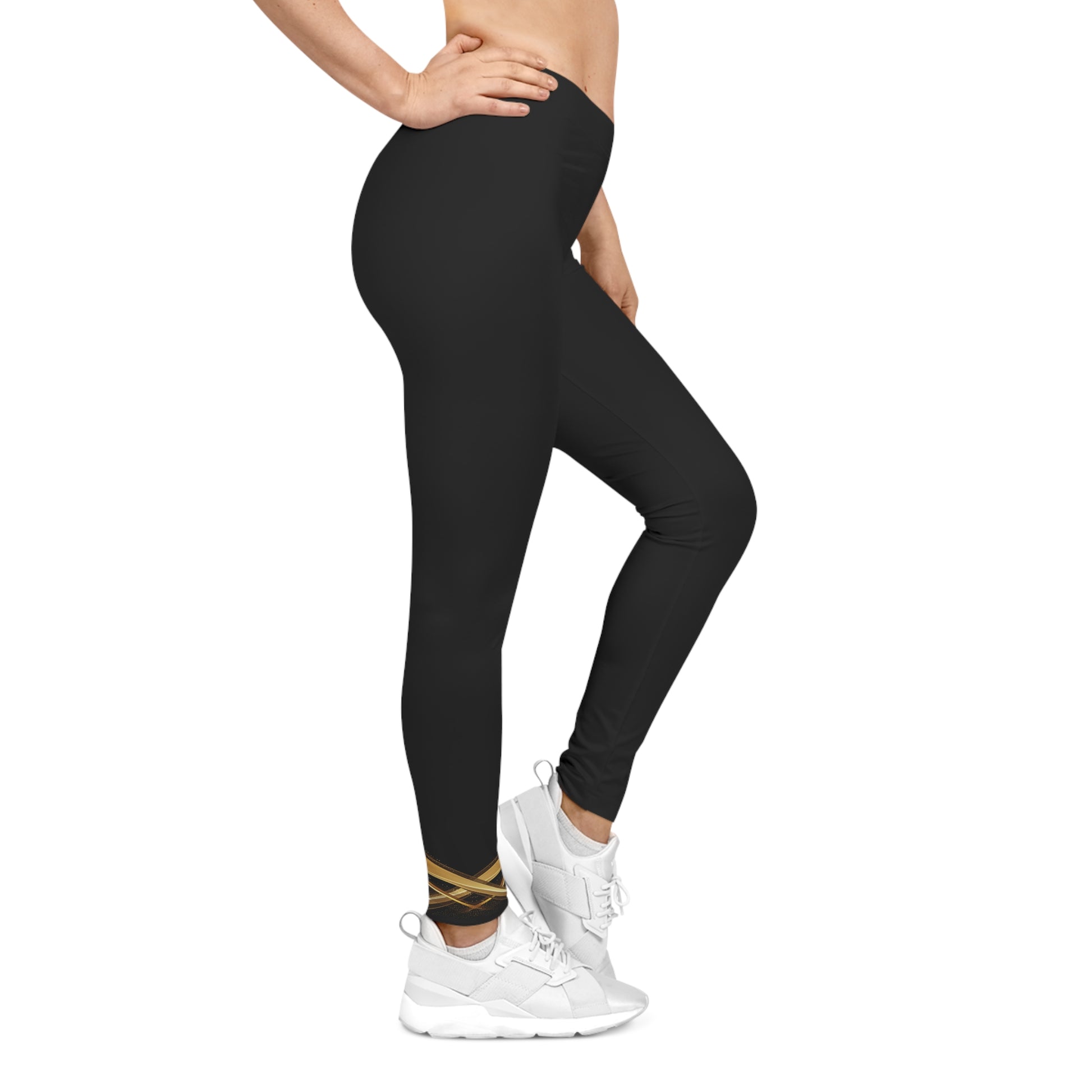 Person wearing black leggings and white sneakers on a white background