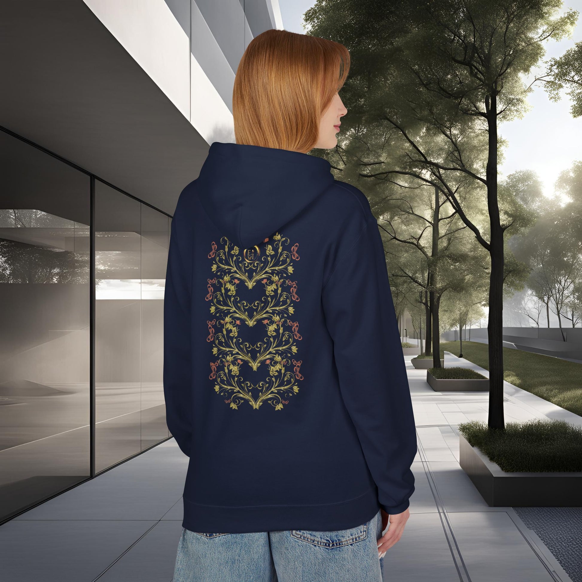 Person wearing a navy blue Essence Innovation Bohemian Butterfly hoodie with a floral design on the back, standing in an urban setting.