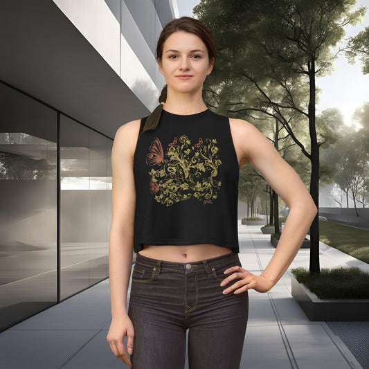 Woman wearing a black sleeveless top with a Essence Innovation Bohemian Butterfly floral design in an outdoor setting