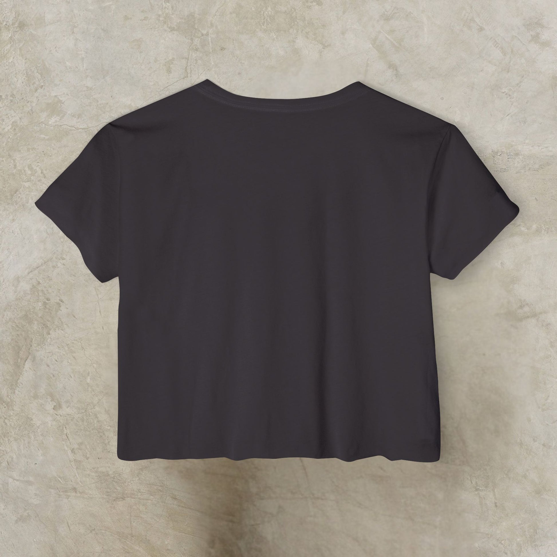 Essence Innovation 'Design Meets Soul' Black t-shirt on a beige textured background