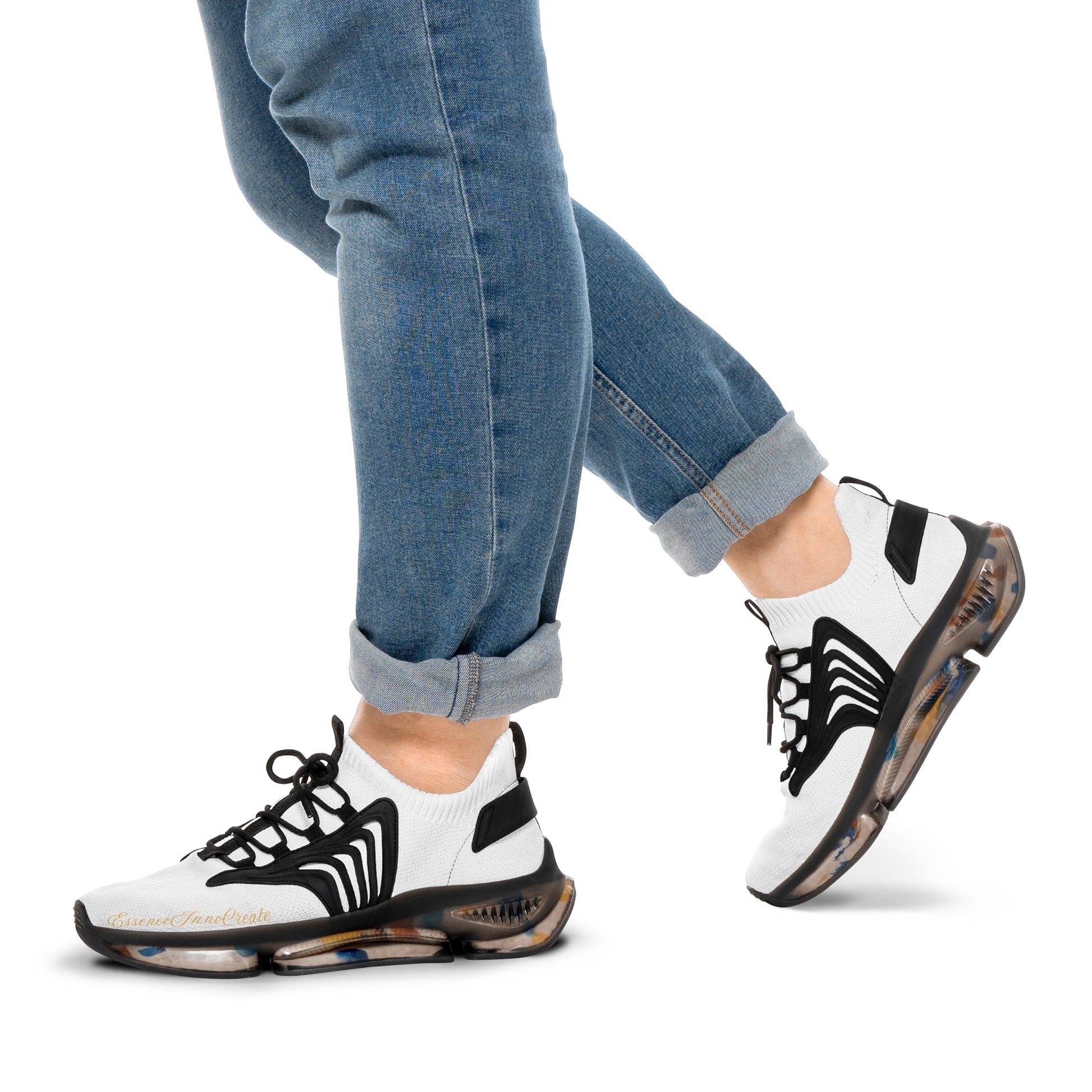 White 'EssenceInnoCreate' sneakers with black accents worn with blue jeans on a white background