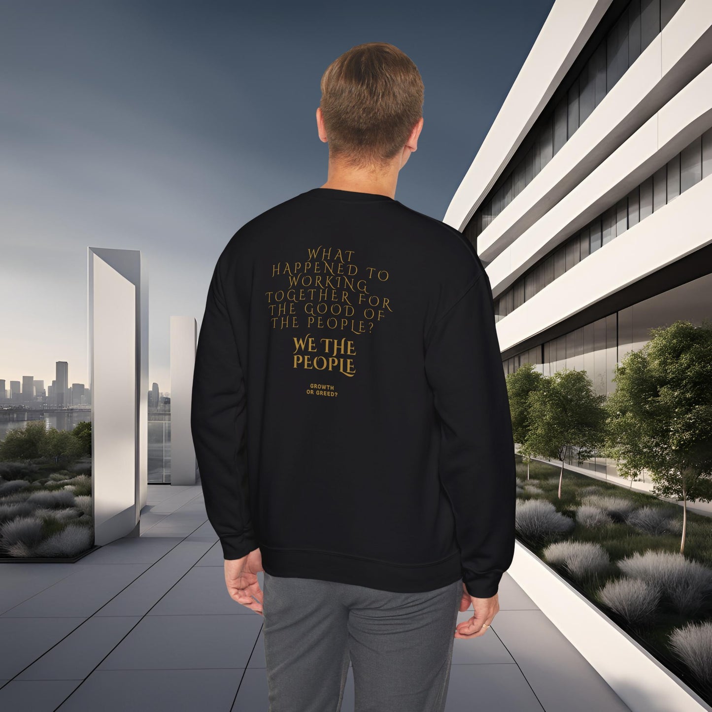Person wearing a black EssenceInnoCreate Quiet Resolve sweatshirt with text in an urban setting