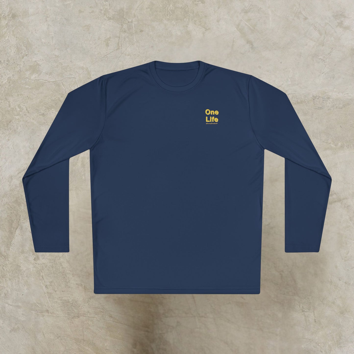 Navy blue long-sleeve shirt with 'One Life' text on a beige surface