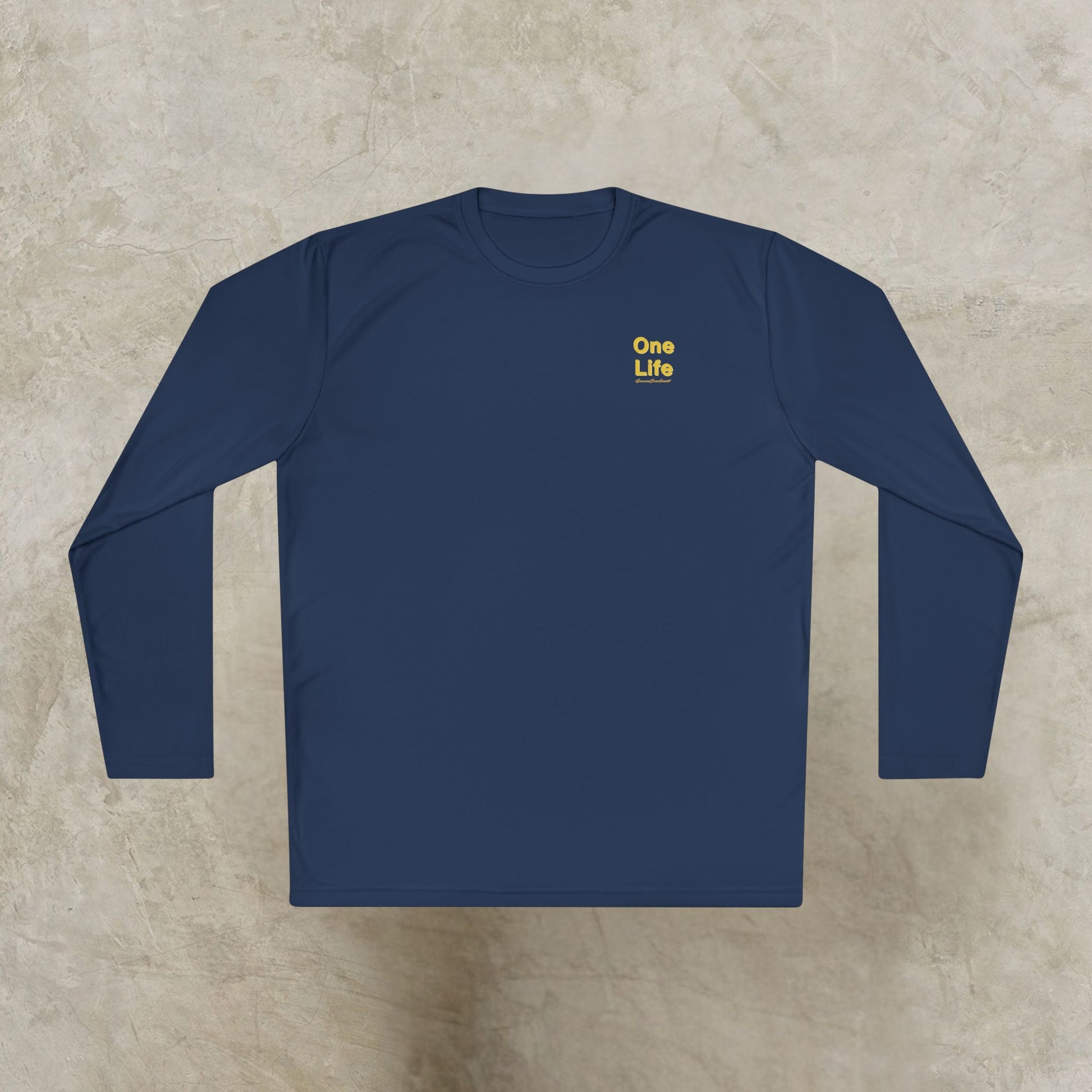 Navy blue long-sleeve shirt with 'One Life' text on a beige surface