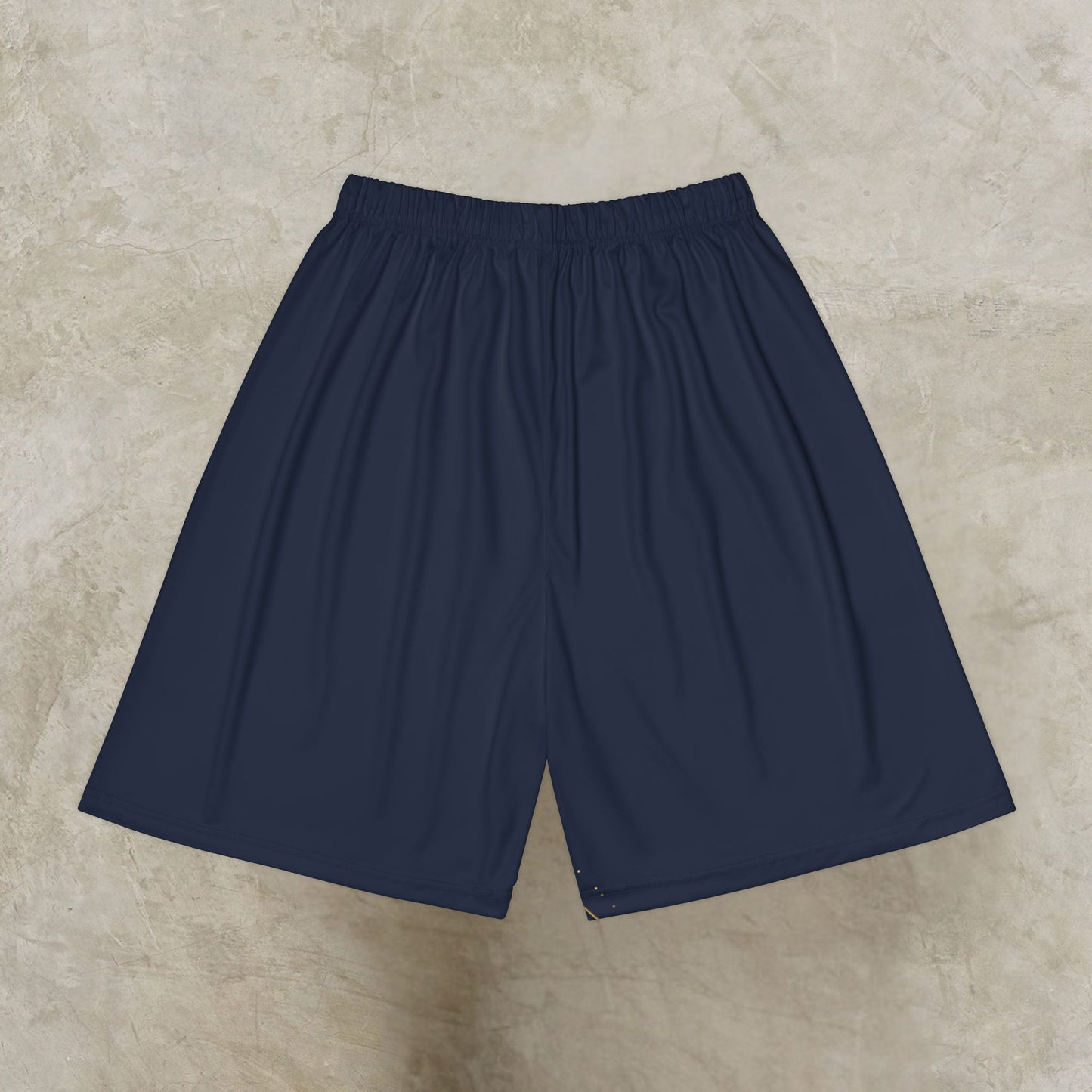 Navy blue shorts on a beige textured background