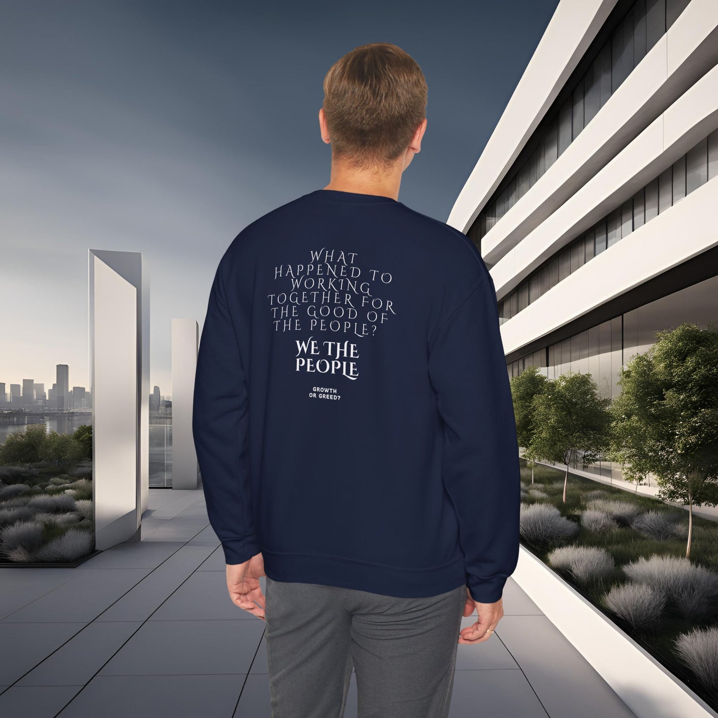 Person wearing a navy blue EssenceInnoCreate Quiet Resolve sweatshirt with text in an urban setting