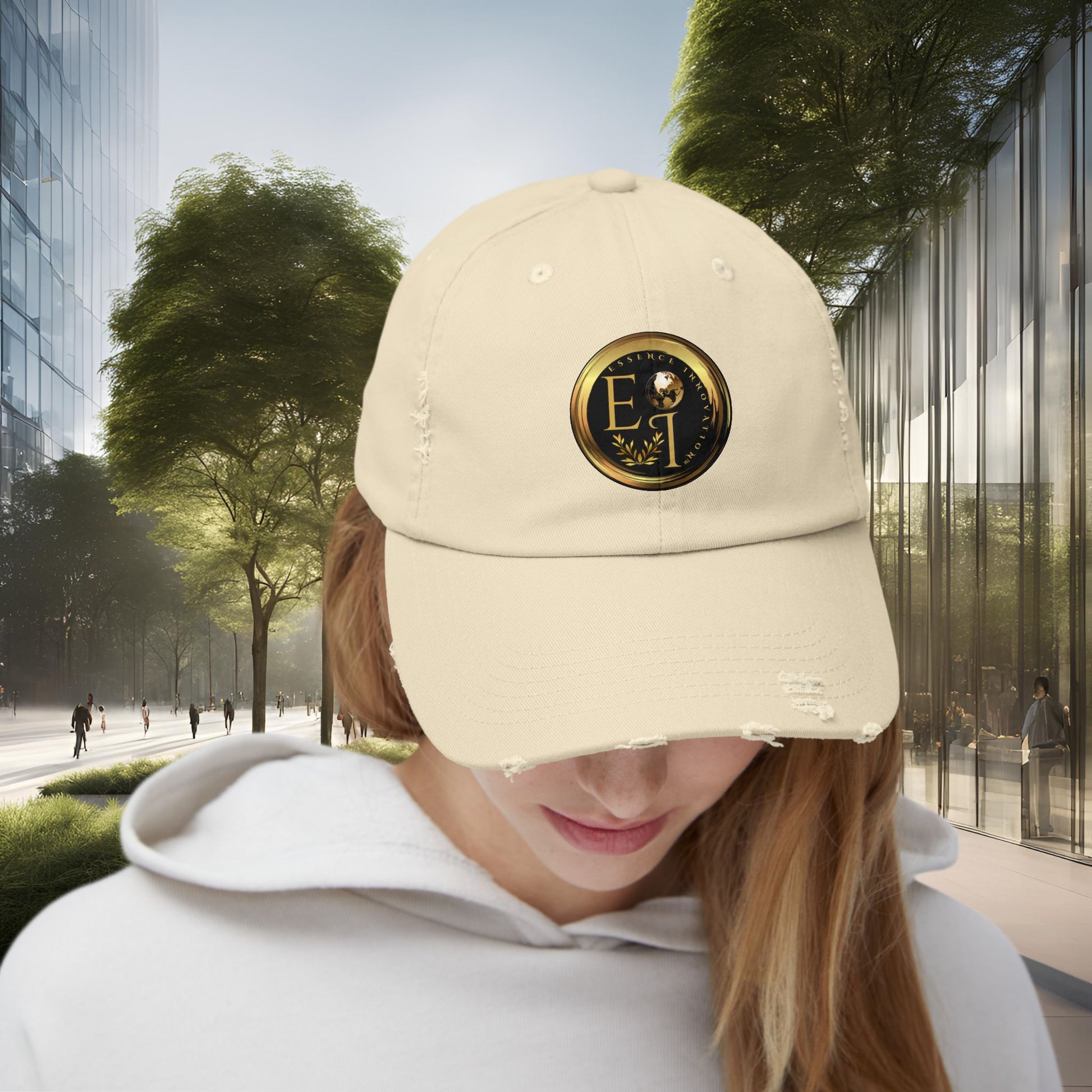 Person wearing a beige Essence Innovation cap with a logo in an urban setting