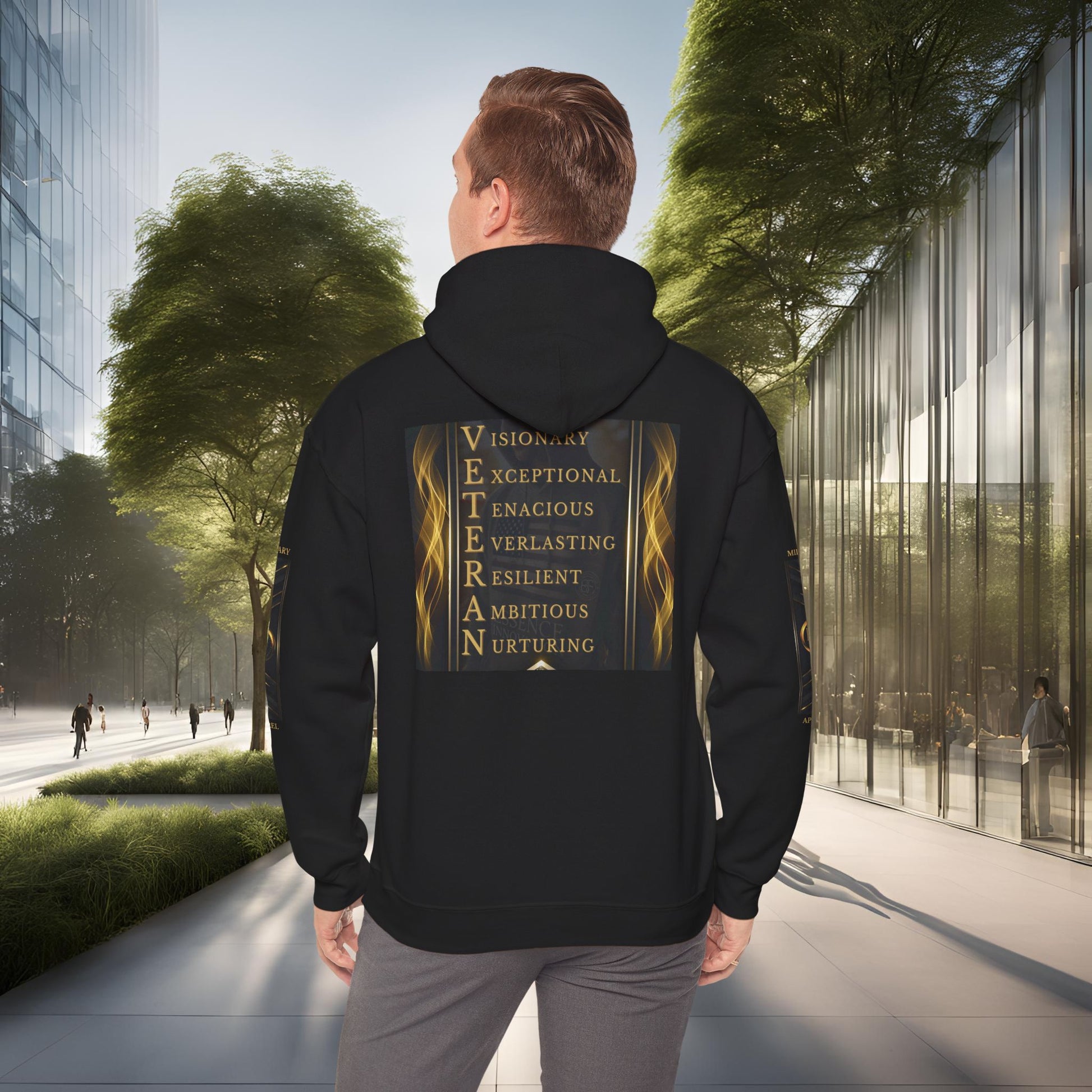 Person wearing a black Essence Innovation hoodie with text on the back in an urban setting