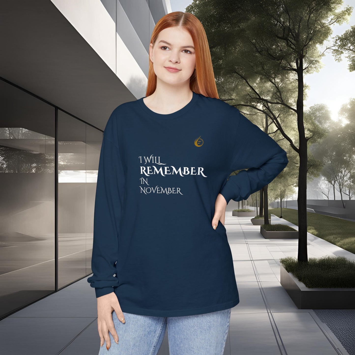 Woman wearing a navy blue long-sleeve EssenceInnoCreate Quiet Resolve shirt with text standing outdoors.