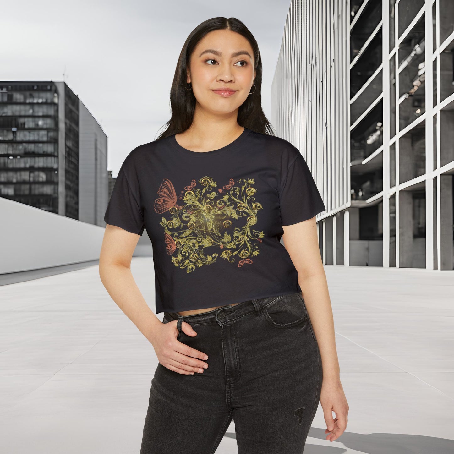 Woman wearing a black t-shirt with a colorful Essence Innovation Bohemian Butterfly design in an urban setting