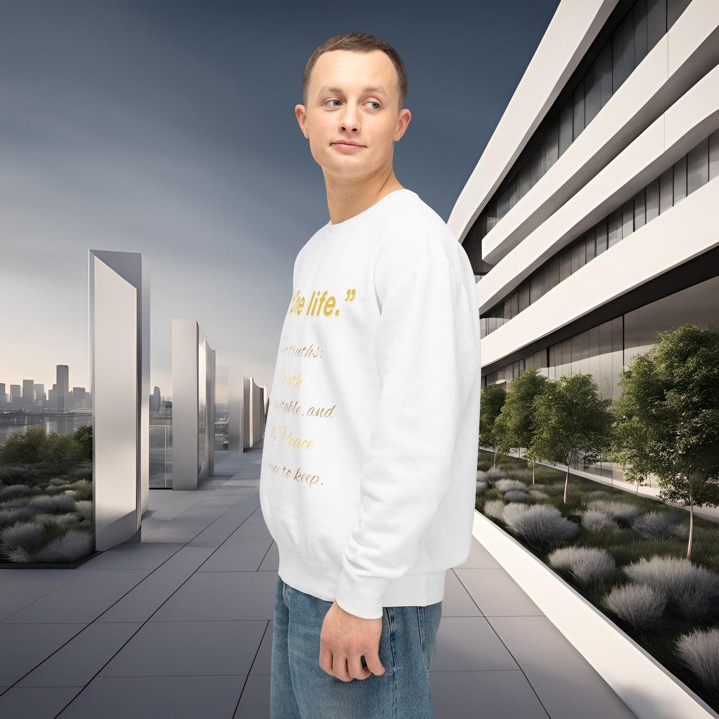 Man wearing a white sweatshirt with text standing in front of modern architectural buildings.