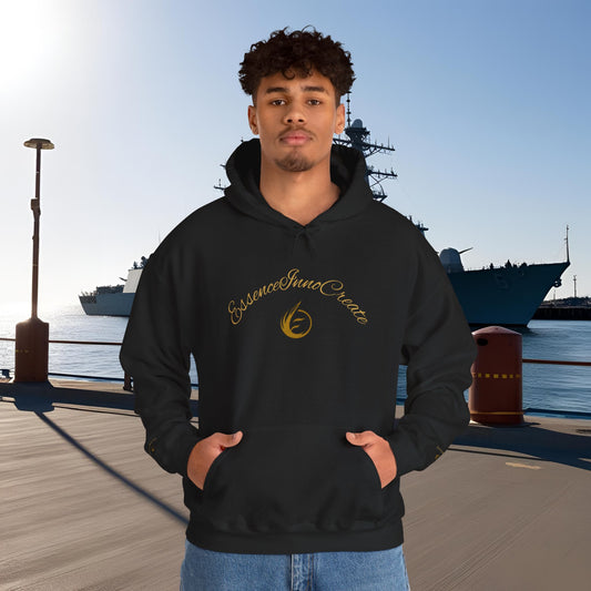 Person wearing a black hoodie with 'EssenceInnoCreate' logo and text, standing on a dock with ships in the background.