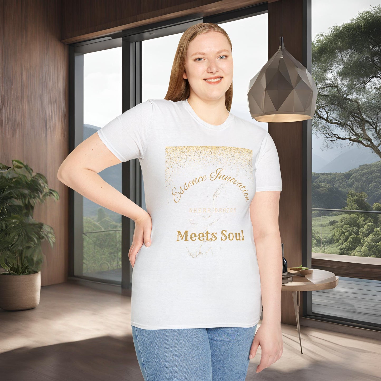 Woman wearing a white t-shirt with gold Essence Innovation 'Design Meets Soul' text in a modern room with large windows.