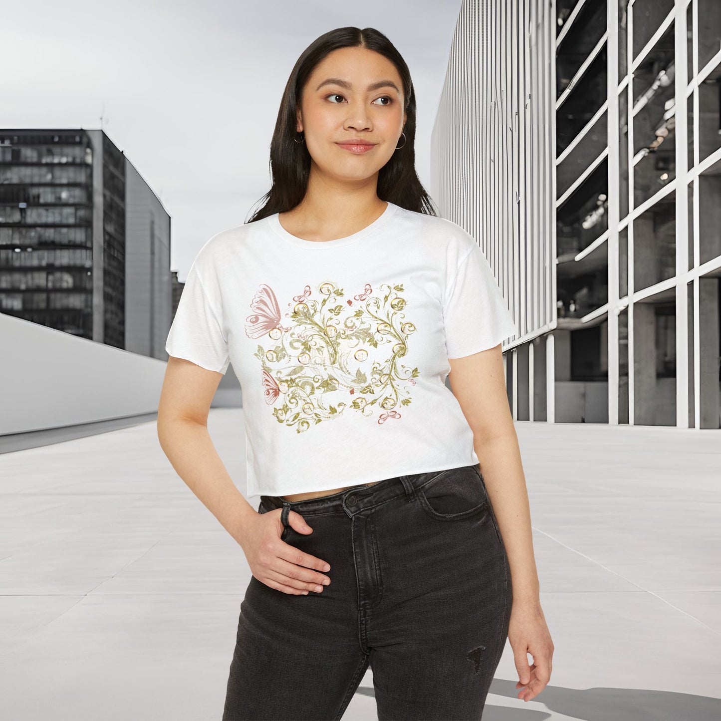Woman wearing a white t-shirt with a floral Essence Innovation Bohemian Butterfly design in an urban setting