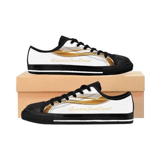 Black and white 'EssenceInnoCreate' sneakers with gold accents on a wooden box