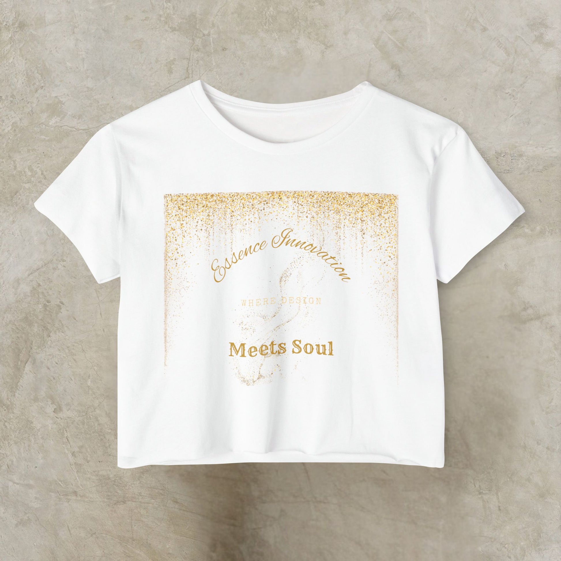 White t-shirt with gold Essence Innovation 'Design Meets Soul' text on a beige background