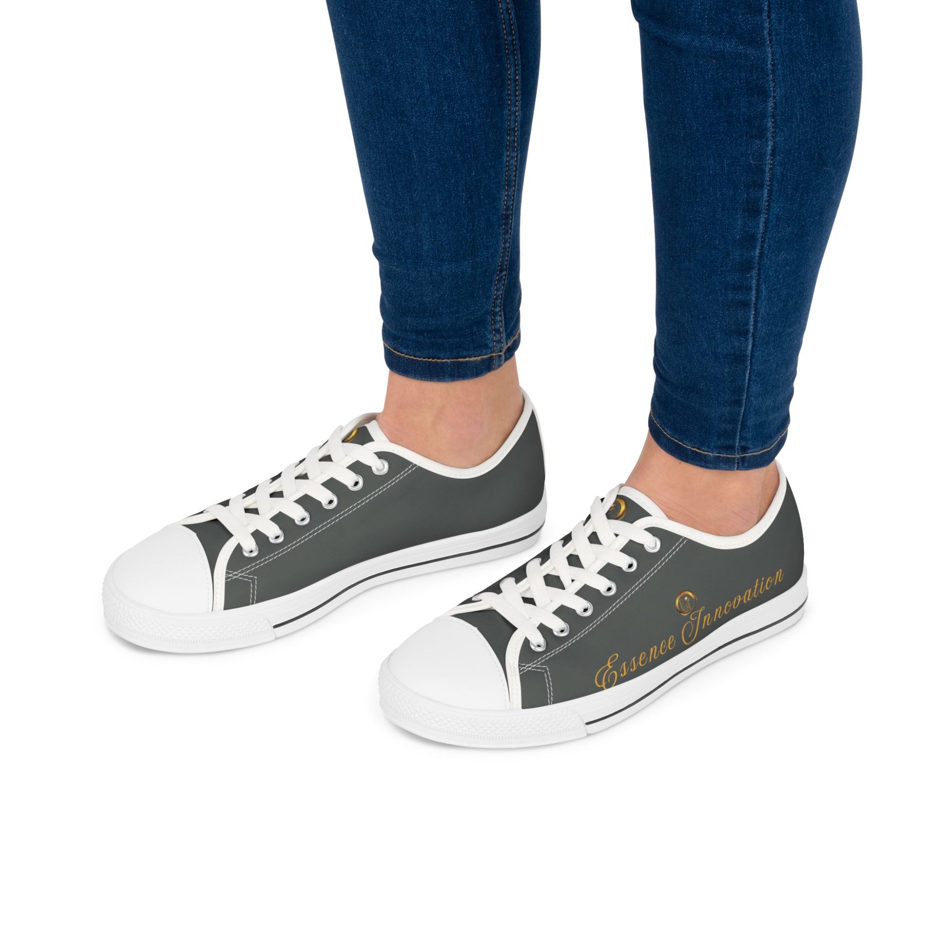 Grey 'Essence Innovation' sneakers with colorful pattern worn with blue jeans on a white background