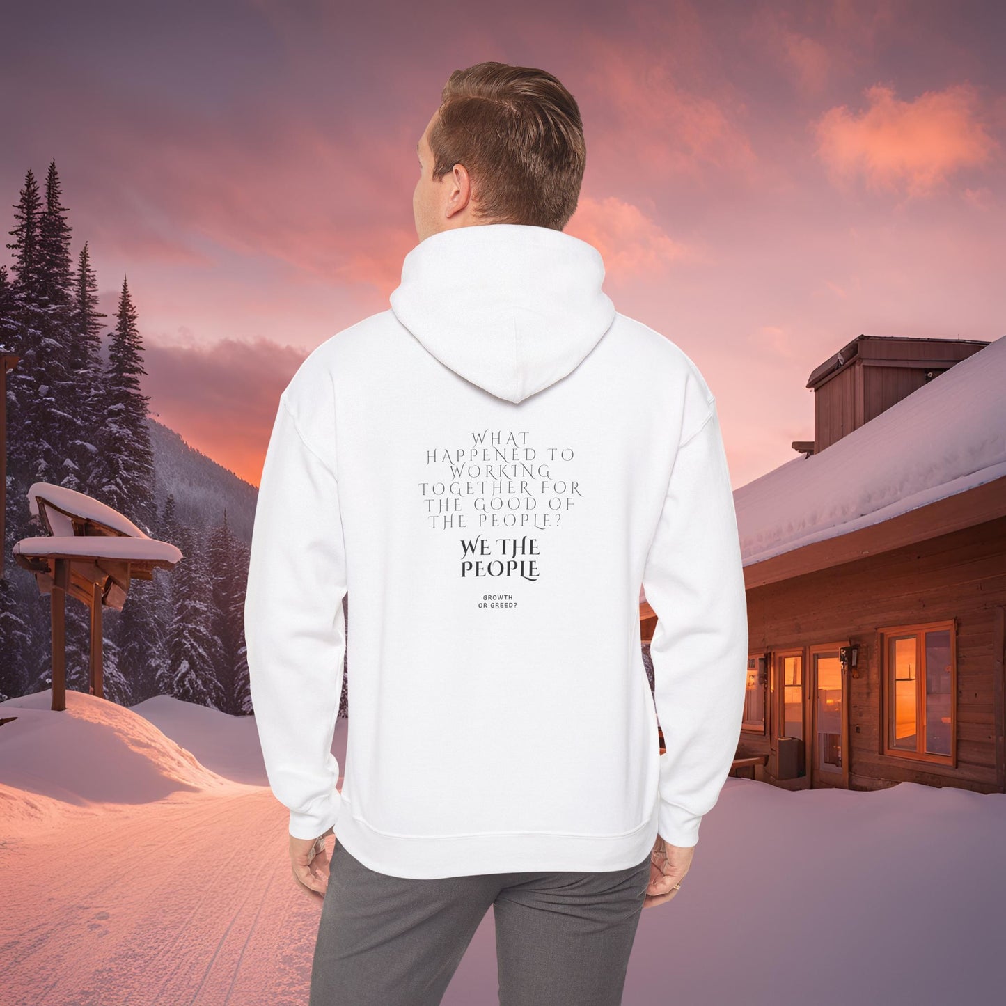 Person wearing a white EssenceInnoCreate Quiet Resolve hoodie with text in a snowy landscape at sunset.
