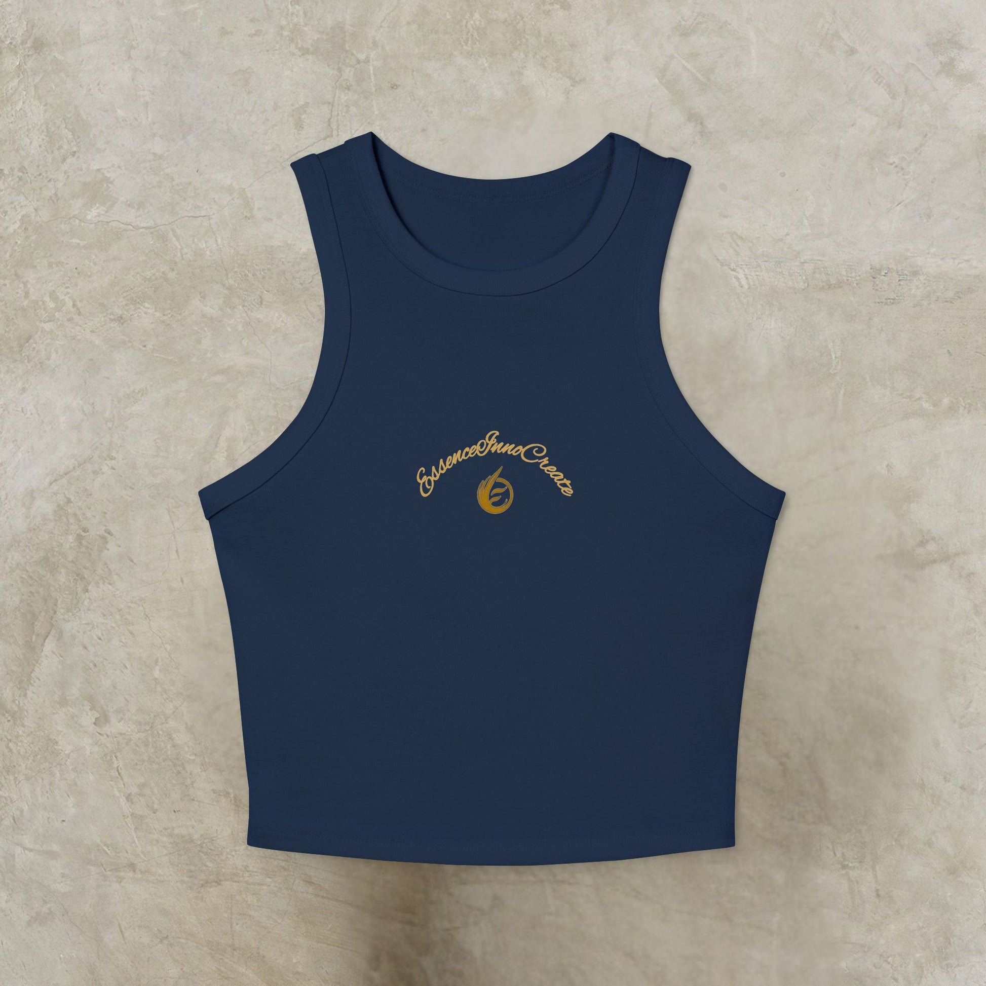 Navy blue tank top with yellow EssenceInnoCreate logo on a beige textured background