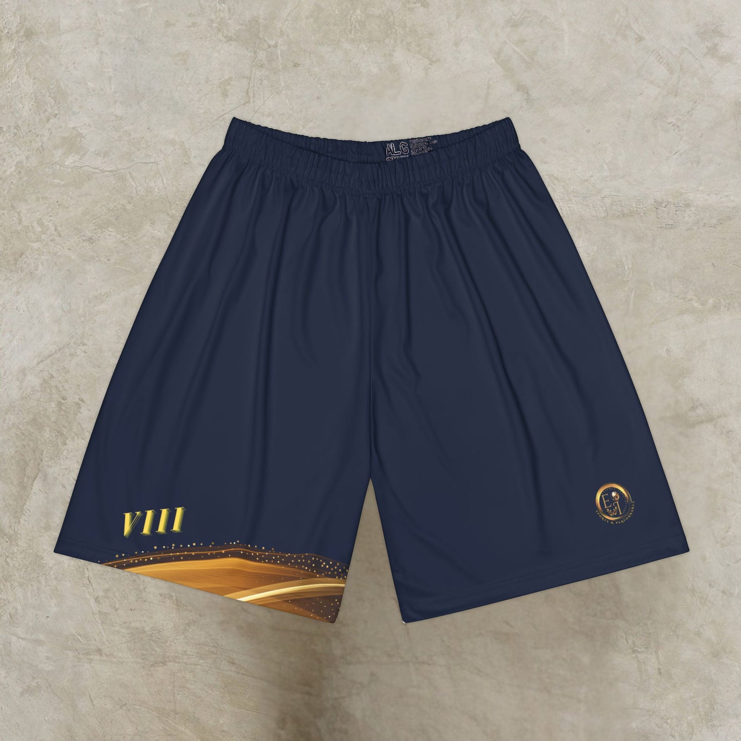 Navy blue shorts with gold accents on a beige surface