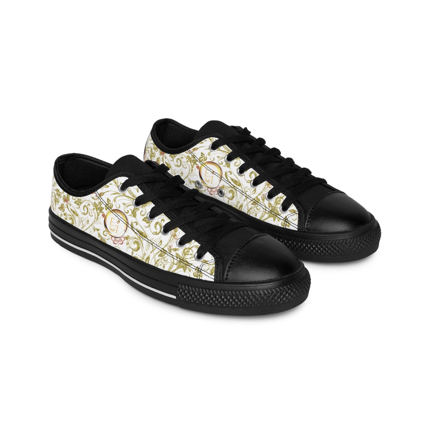 Black and white Essence Innovation sneakers with gold accents on a white background