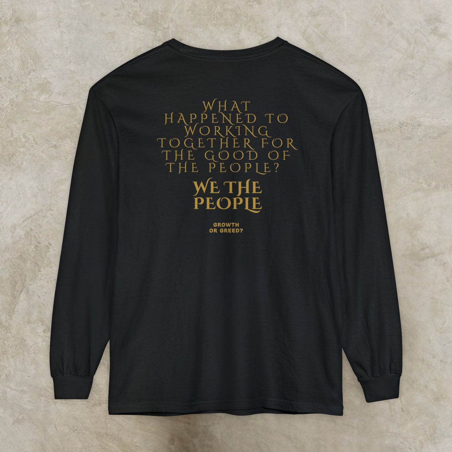 Black long-sleeve EssenceInnoCreate Quiet Resolve shirt with gold text on a beige background