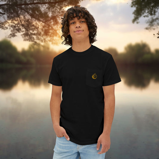 Person wearing a black t-shirt with a 'EssenceInnoCreate' logo standing by a lake at sunset.