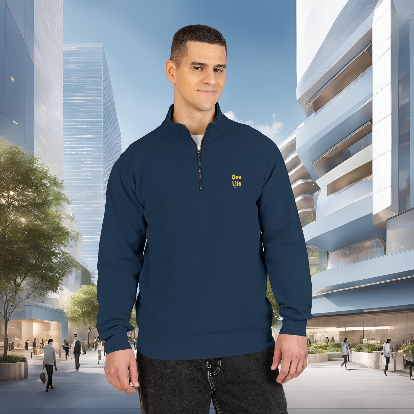 Man wearing a navy blue pullover with a One Life logo in an urban setting