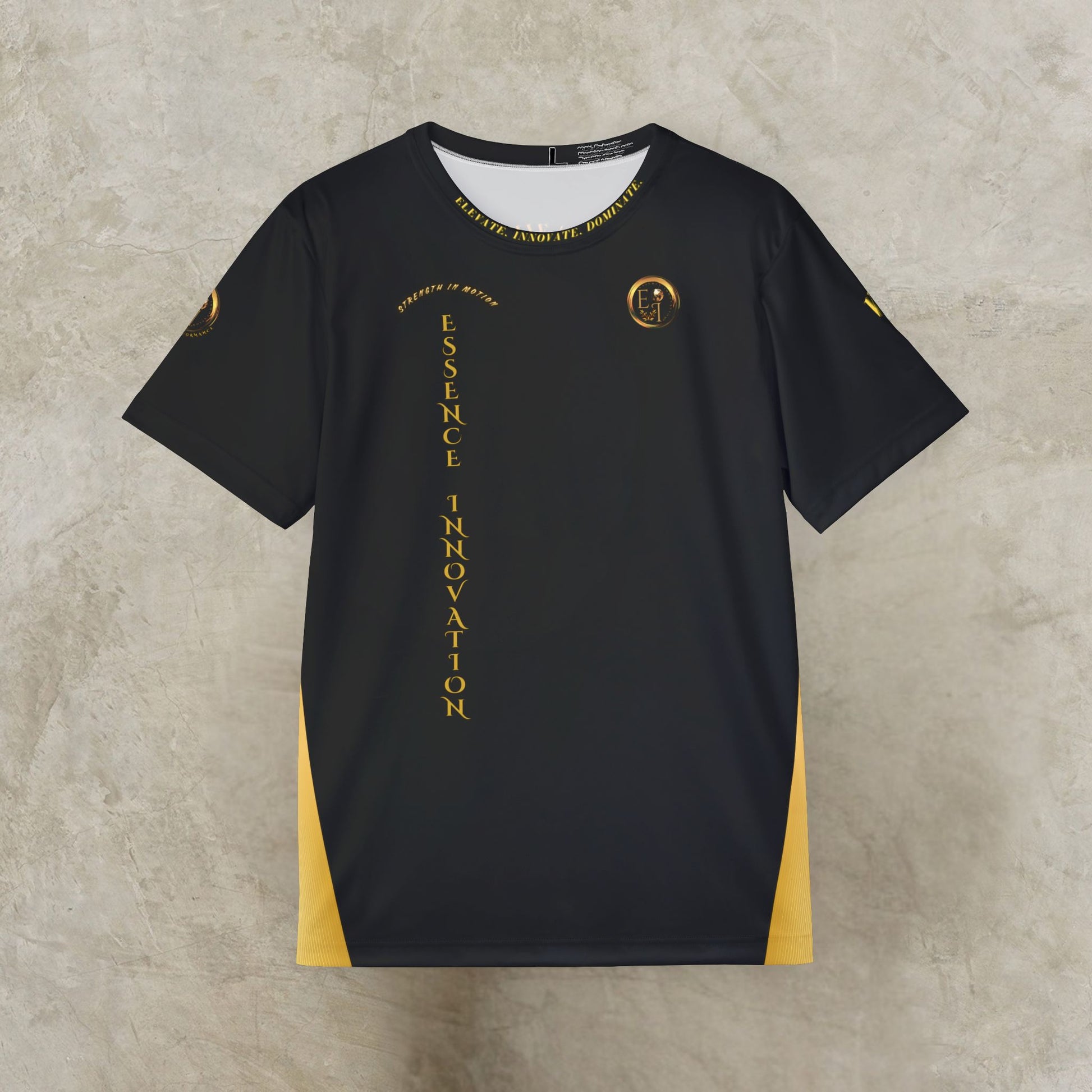 Black t-shirt with gold Essence Innovation logo and text and design on a textured beige background