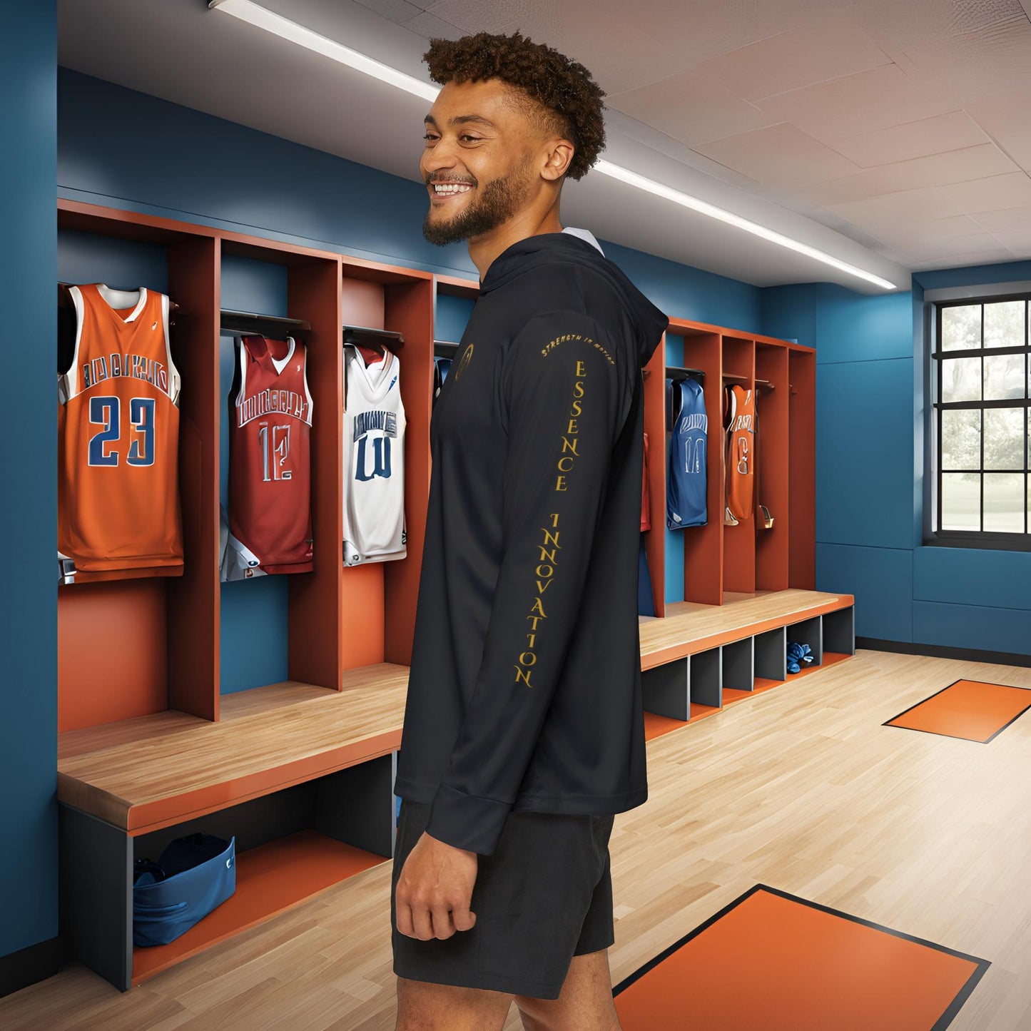 Man standing in a locker room with Essence Innovation Seek More hoodie viewing jerseys on the wall