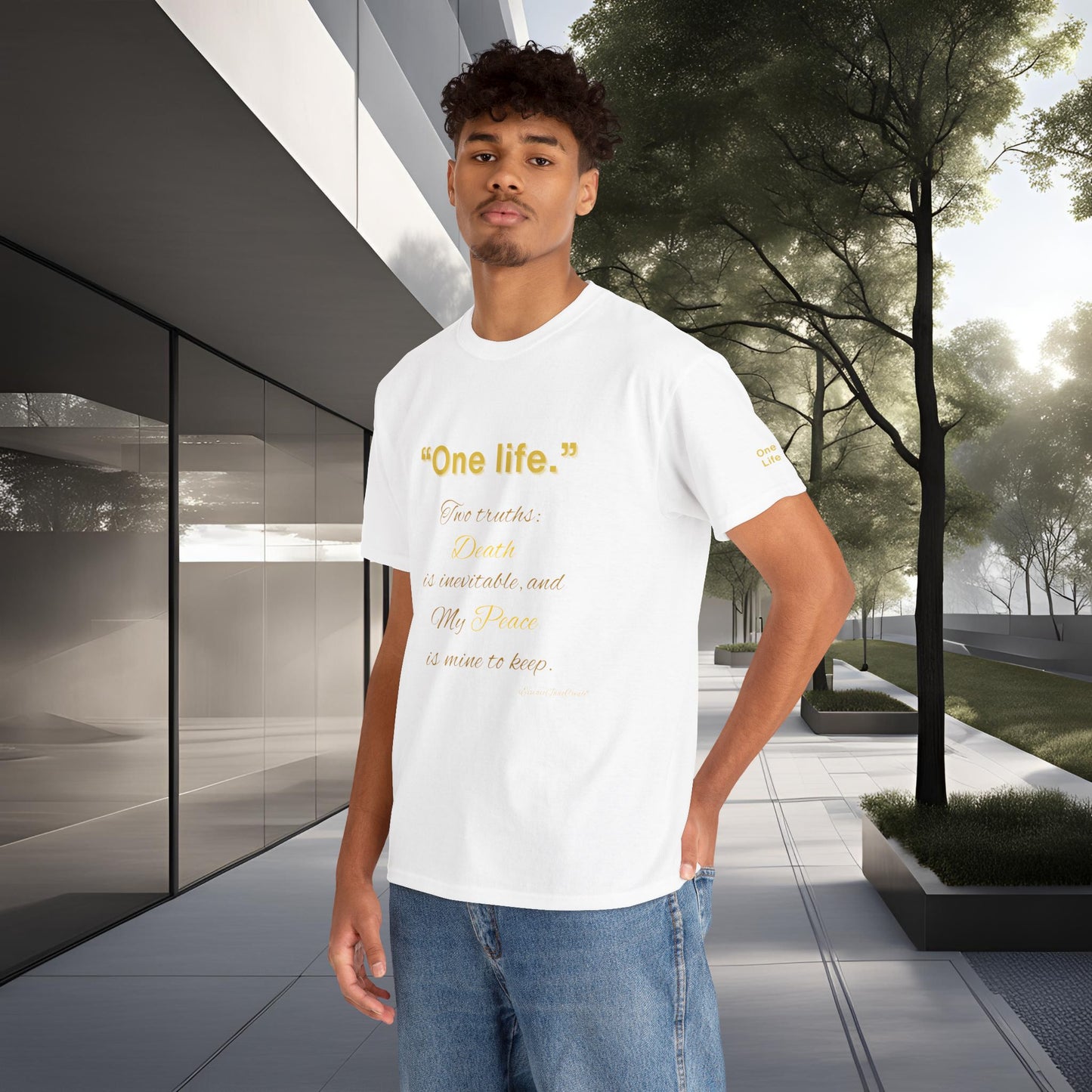 Person wearing a white t-shirt with One Life text in an outdoor setting