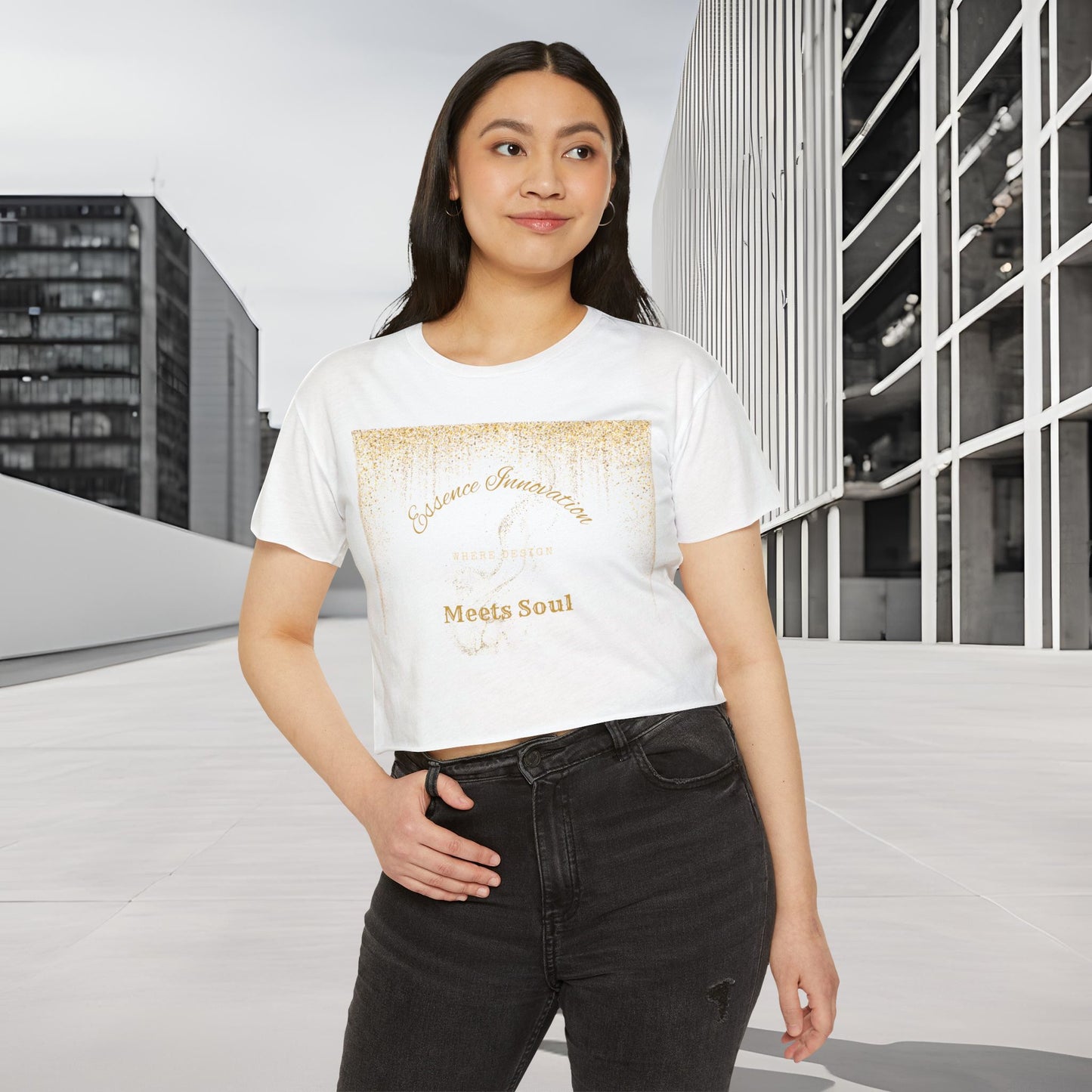 Woman wearing a white t-shirt with Essence Innovation 'Design Meets Soul' text and graphics, standing in an urban setting.