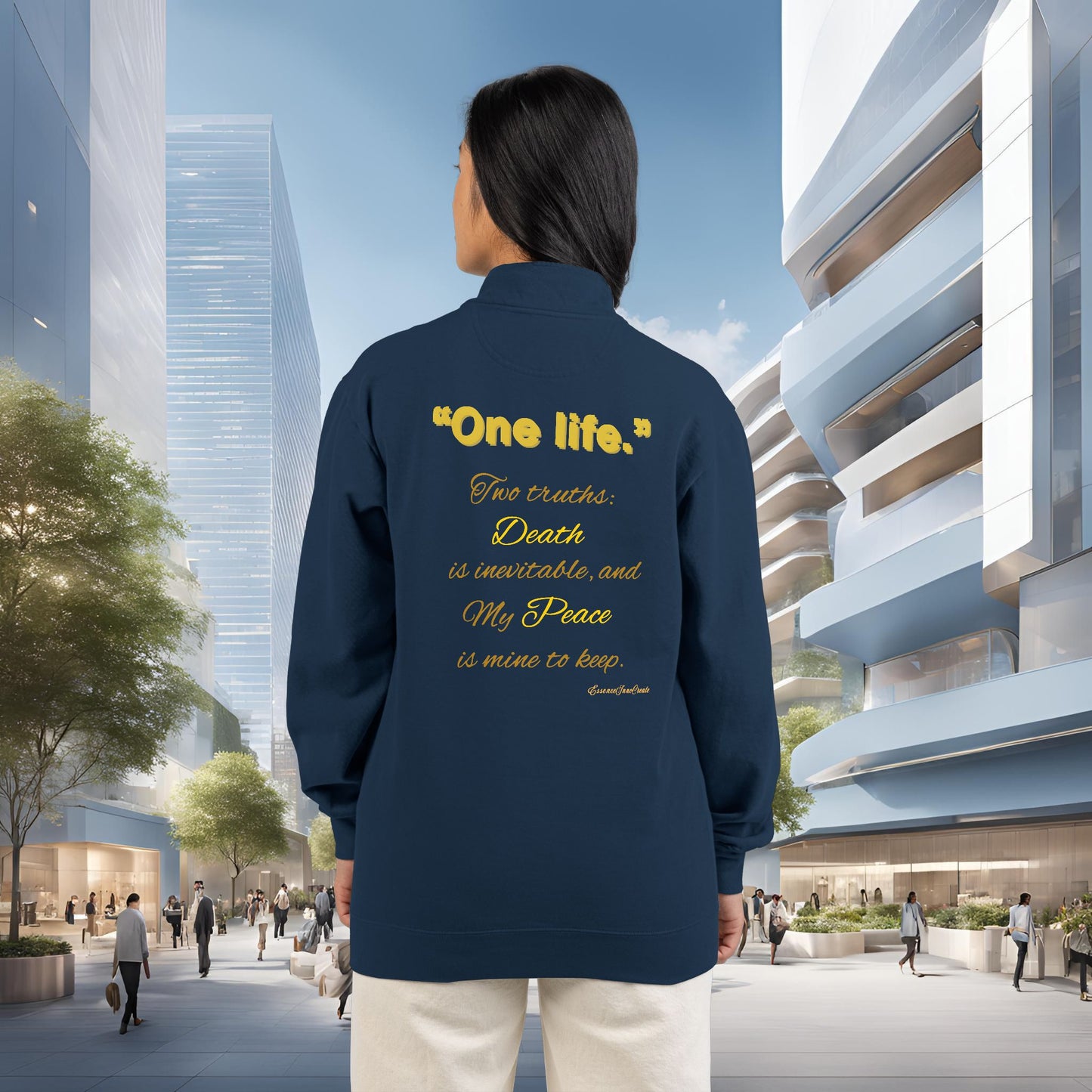 Person wearing a navy blue jacket with One Life text on the back in an urban setting