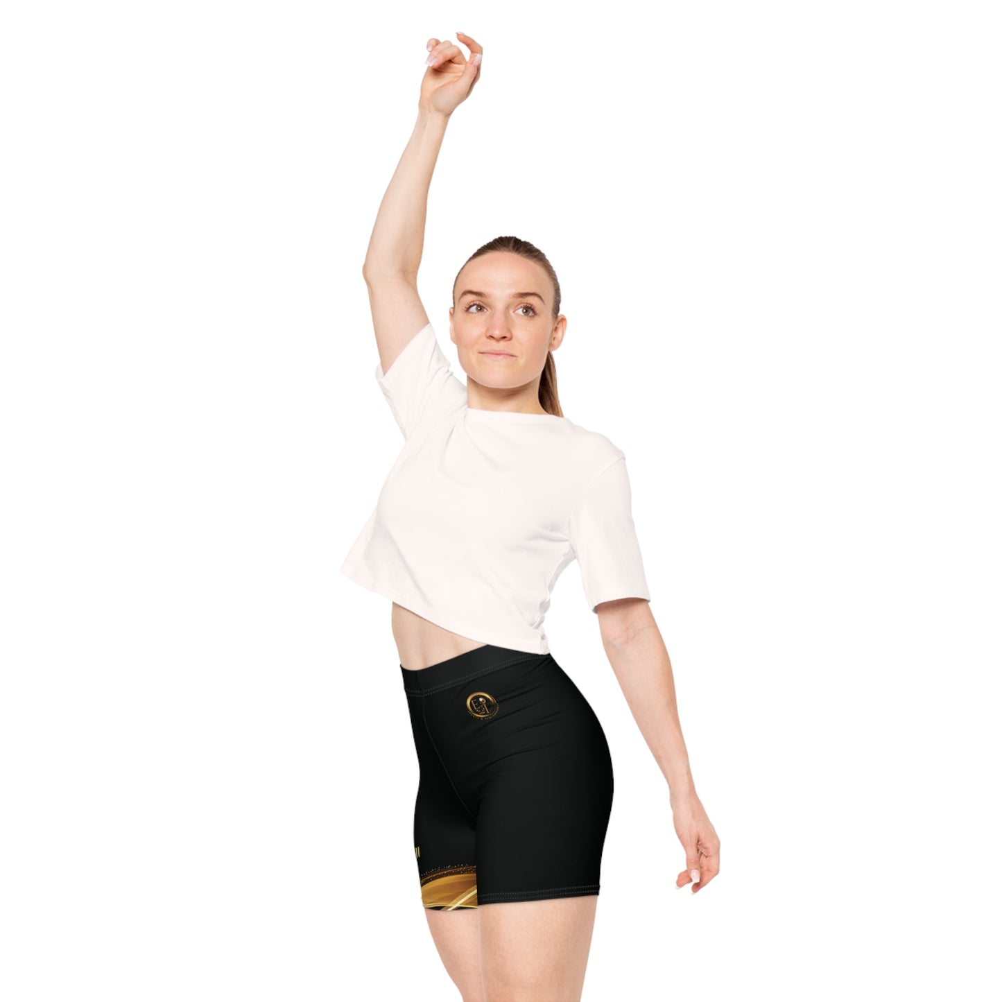Woman wearing black high-waisted shorts with gold accents on a white background