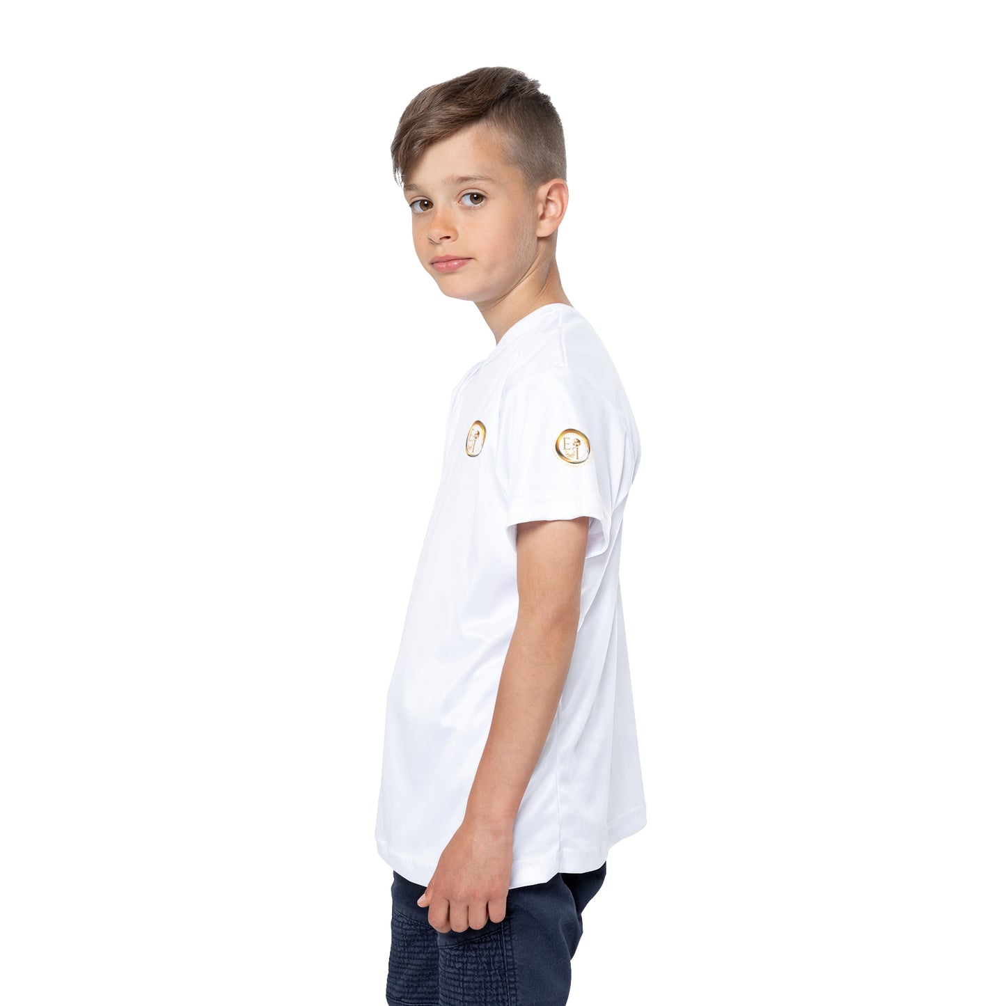 Child wearing a white t-shirt with logos on the sleeves against a white background