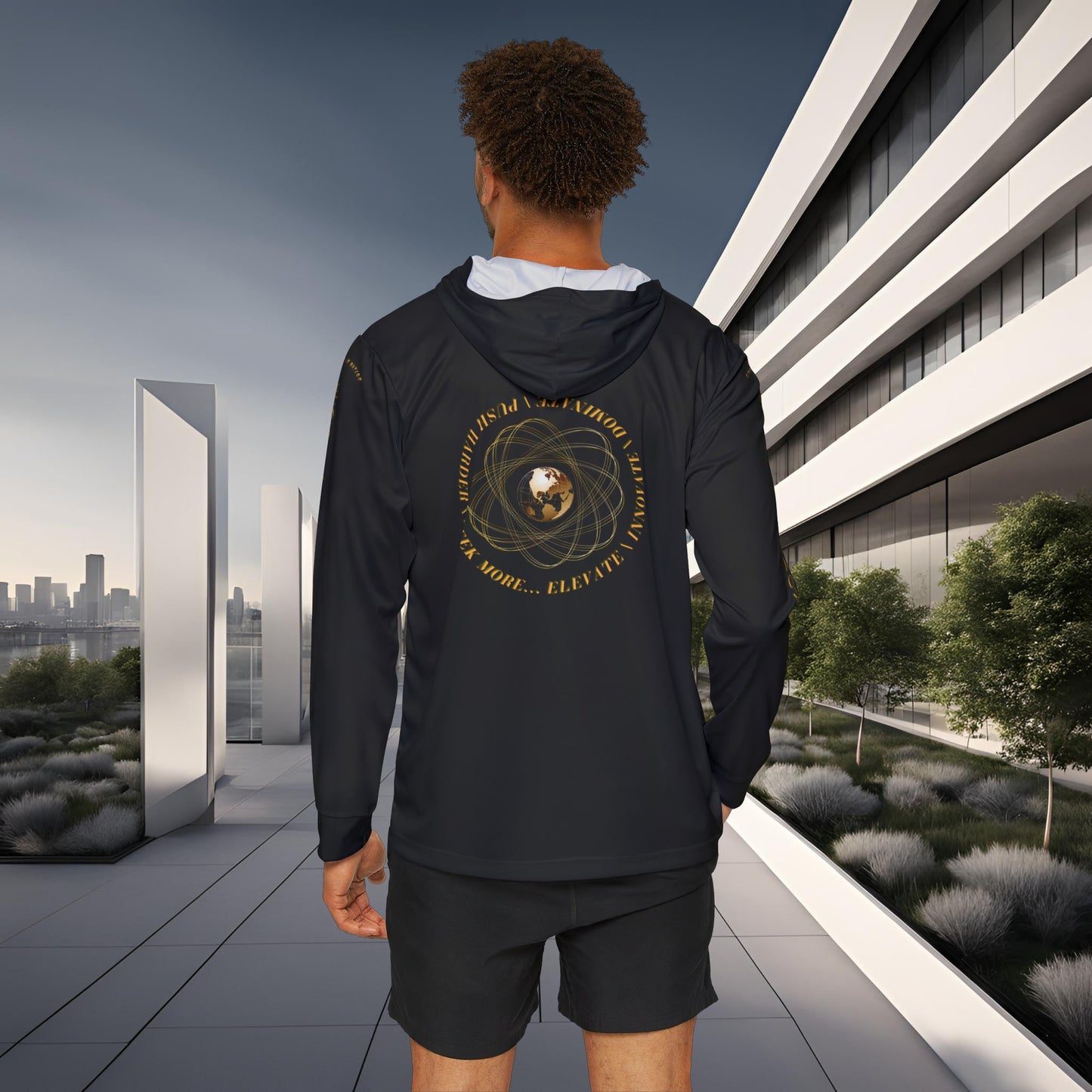 Person wearing a black Essence Innovation Seek More hoodie with a design on the back, standing in an urban setting.
