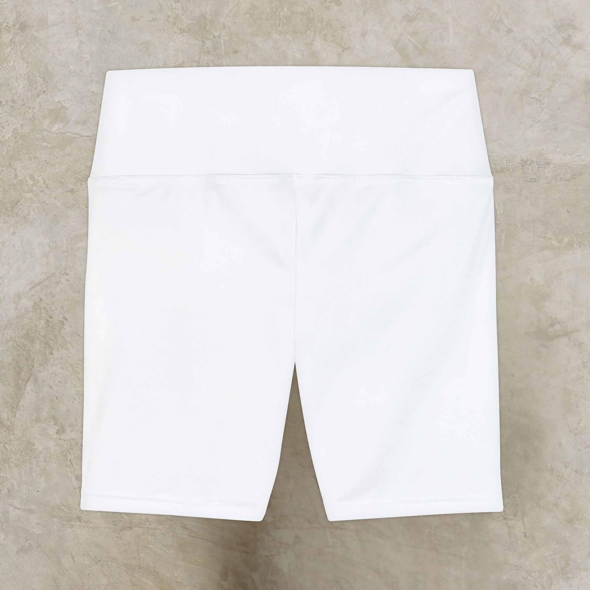 White shorts on a beige textured surface