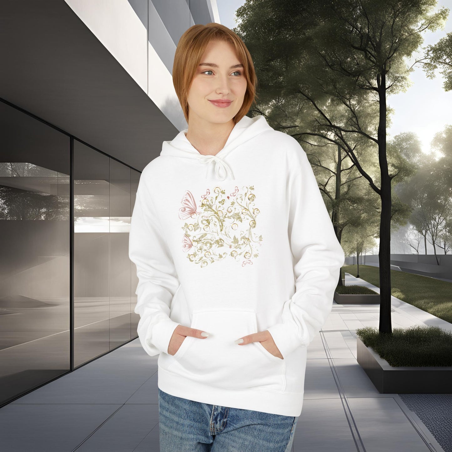 Person wearing a white hoodie with a floral Essence Innovation Bohemian Butterfly design in an outdoor setting