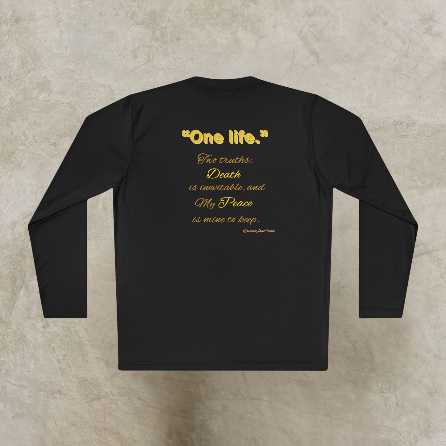 Black long-sleeve shirt with gold One Life text on a textured beige background