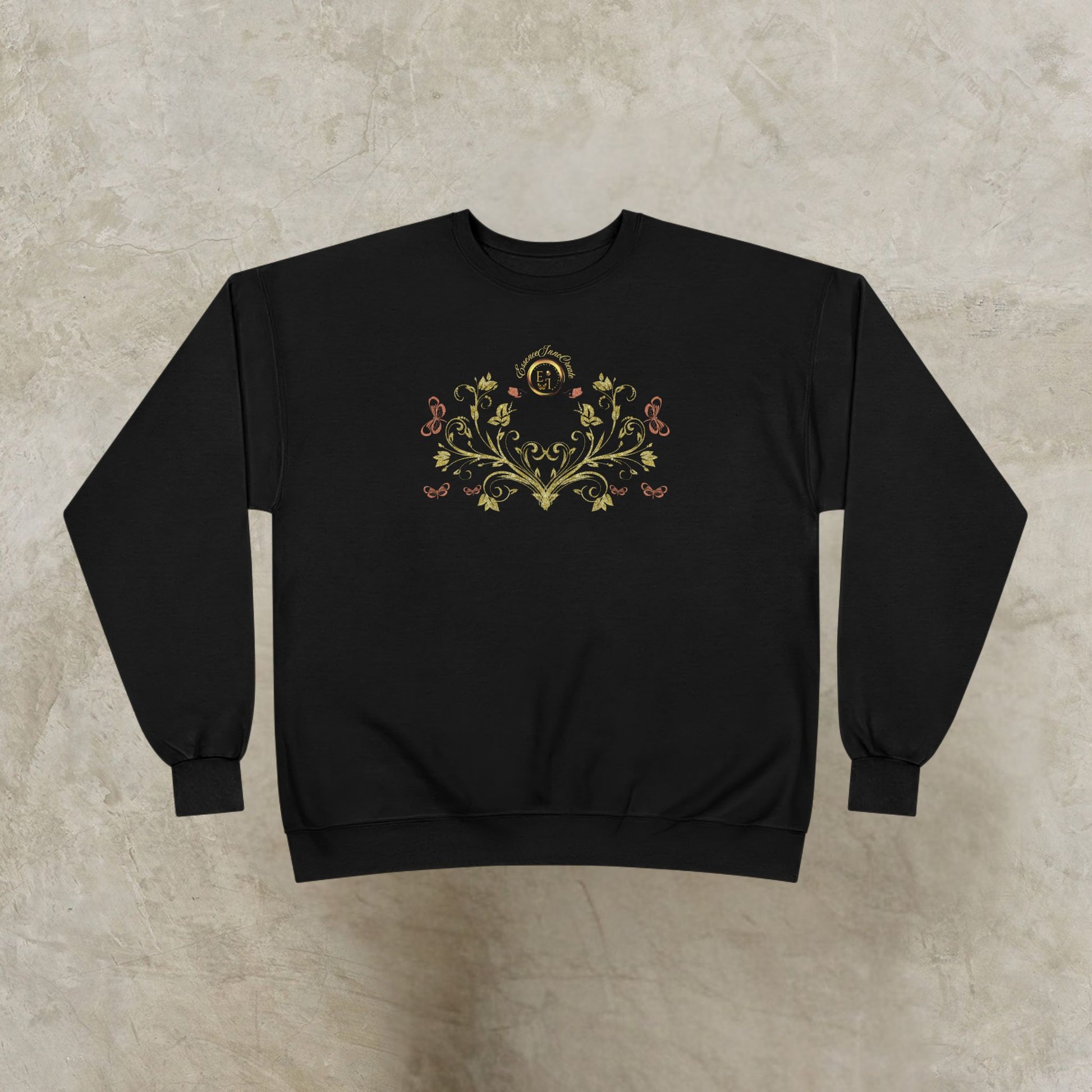 Black sweatshirt with floral Essence Innovation Bohemian Butterfly Crest design on a beige background
