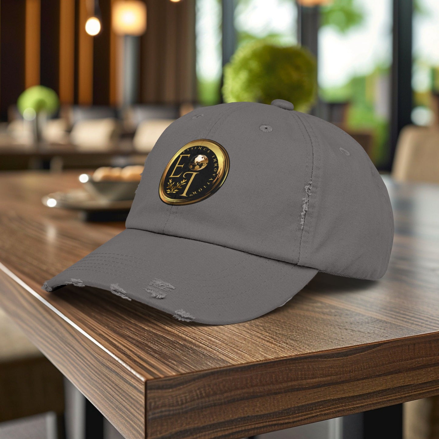 Gray Essence Innovation cap with a logo on a wooden table in a blurred indoor setting