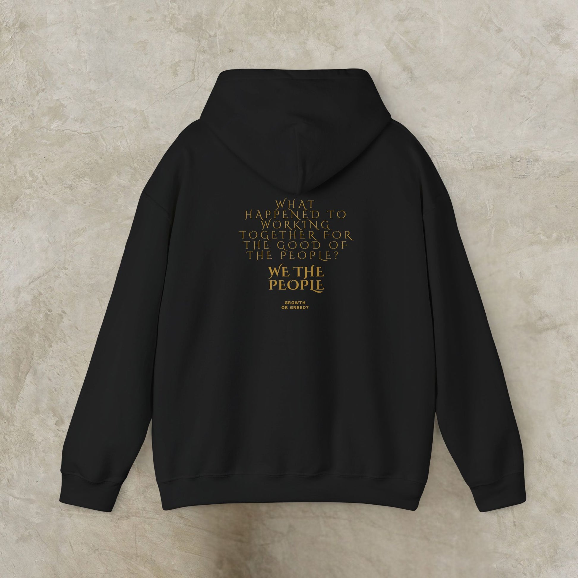 Black EssenceInnoCreate Quiet Resolve hoodie with gold text on a beige background