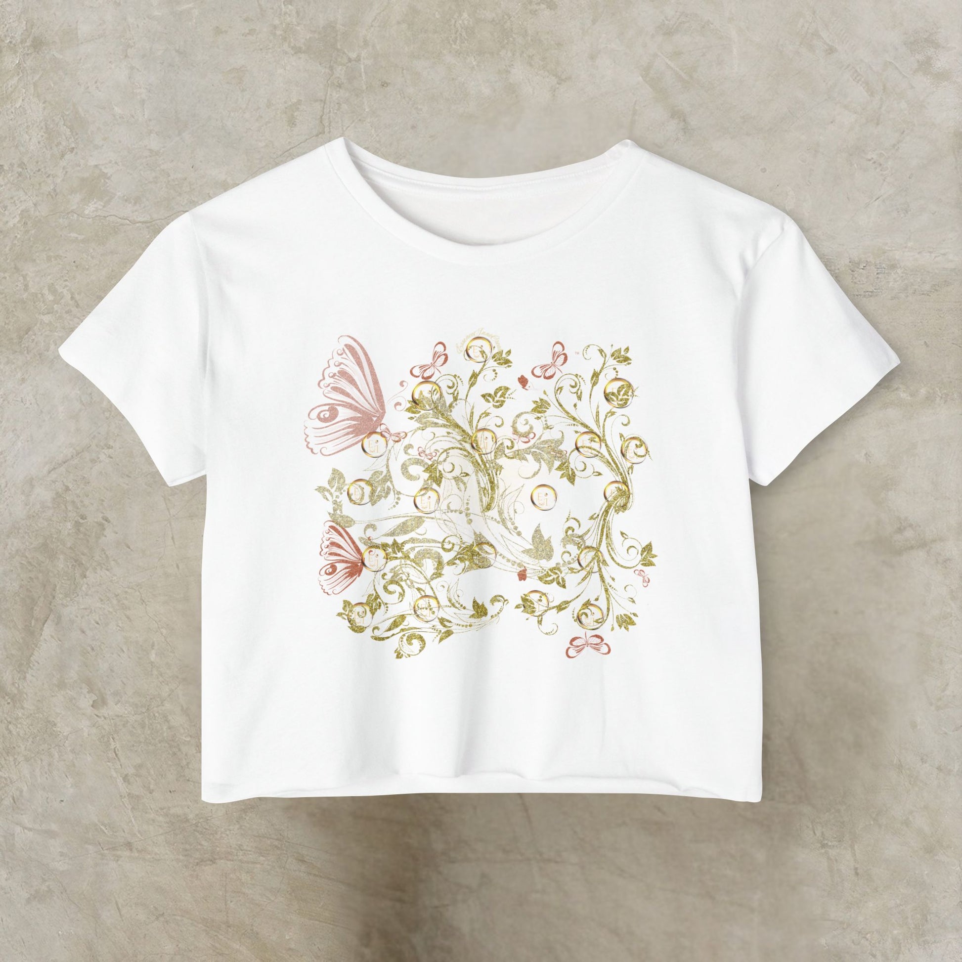 White t-shirt with floral and Essence Innovation Bohemian Butterfly design on a beige background