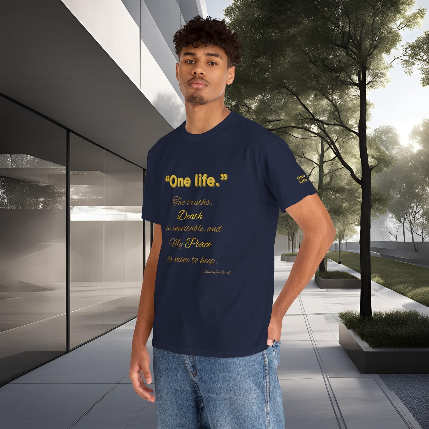 Person wearing a navy blue t-shirt with yellow One Life text in an outdoor setting