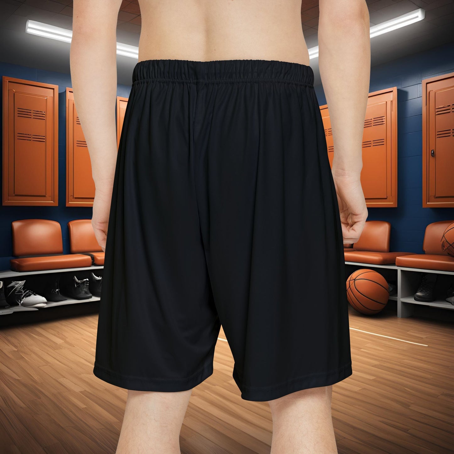 Person wearing black Essence Innovation shorts with text in a locker room setting