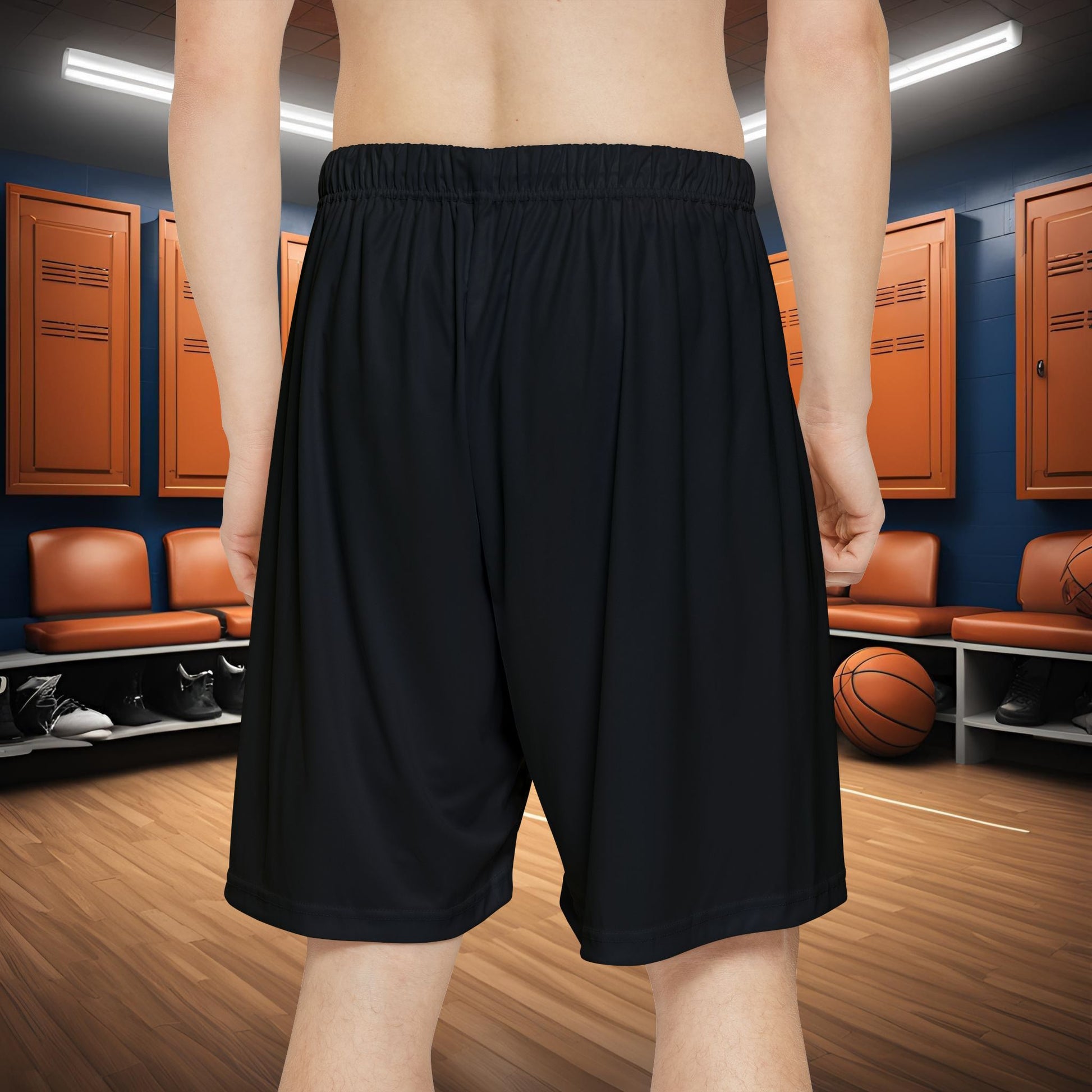 Person wearing black Essence Innovation shorts with text in a locker room setting